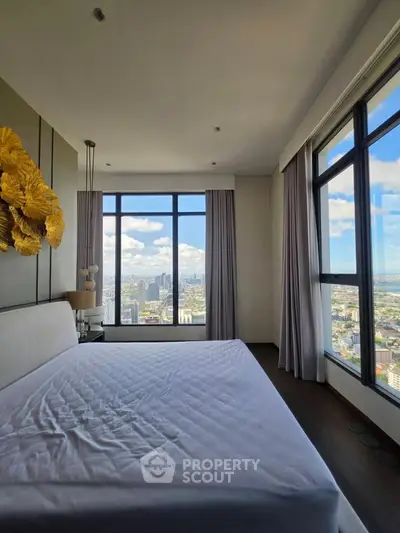 Luxurious bedroom with stunning city view and elegant decor