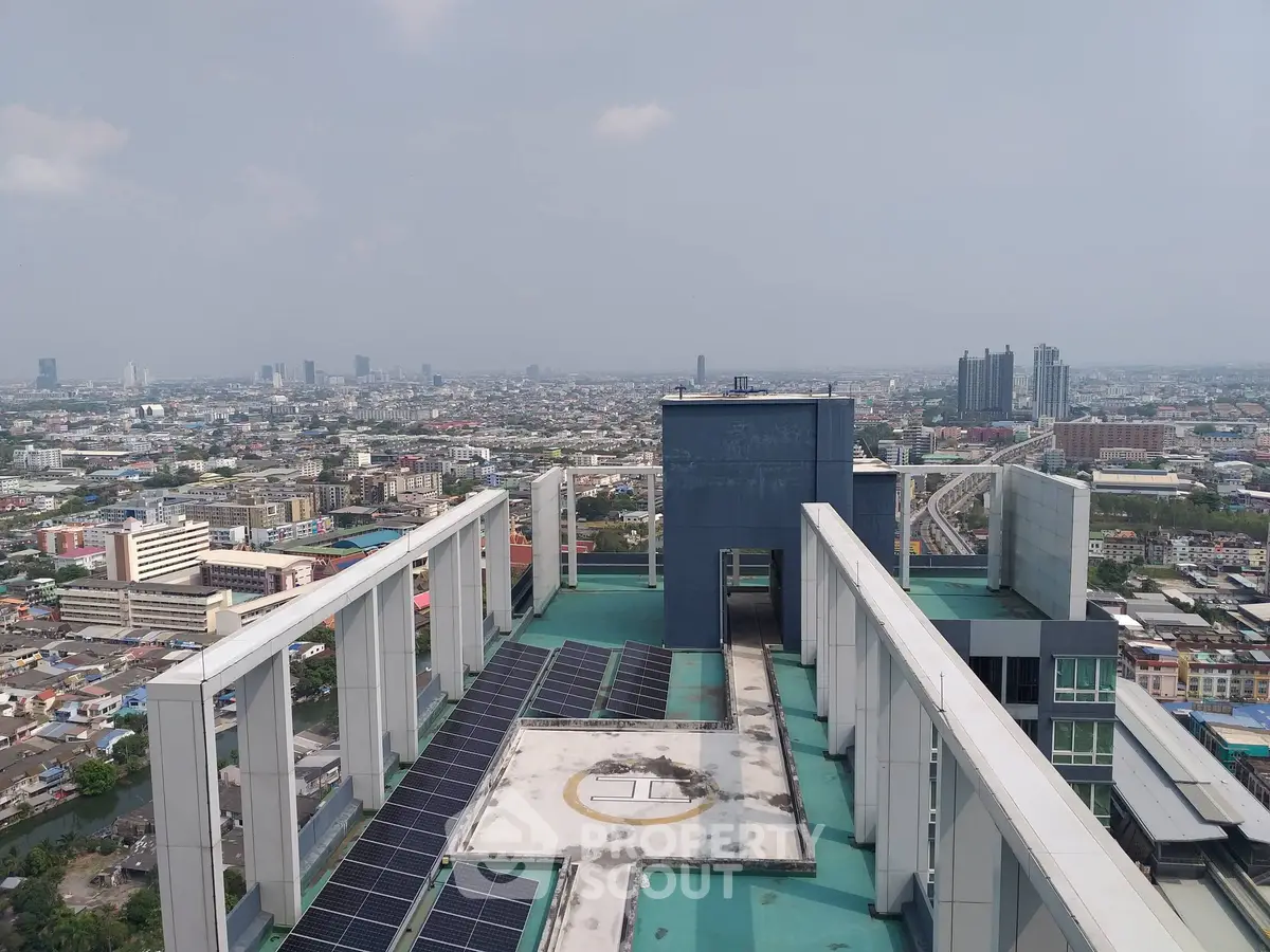 Stunning rooftop view of urban skyline with helipad and solar panels