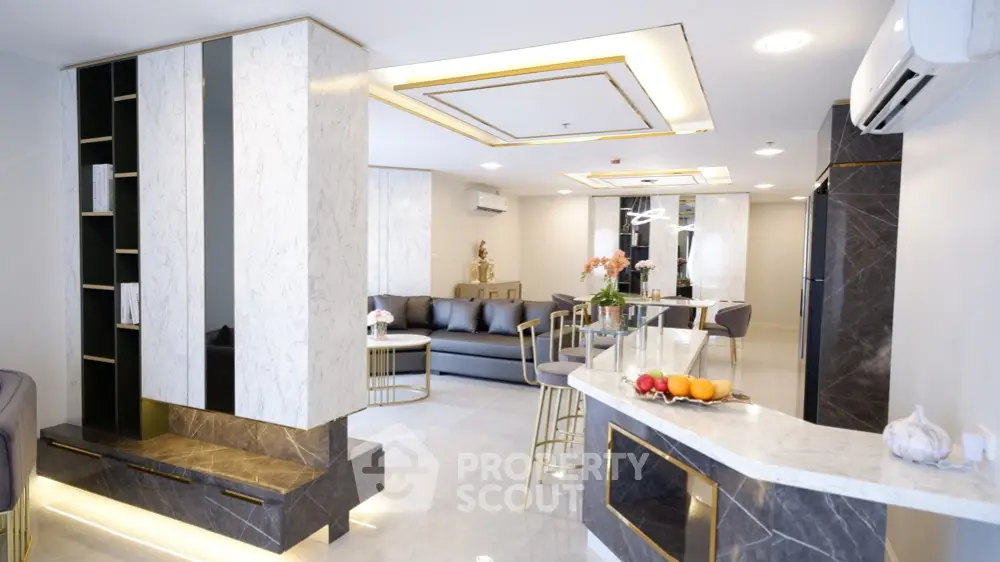 Luxurious modern living room with open kitchen and elegant marble decor