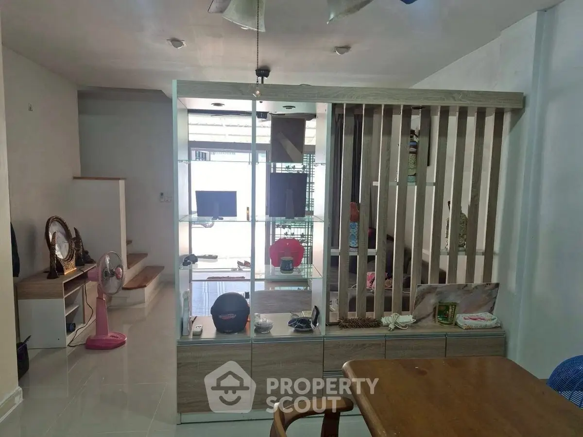 Modern living room with stylish partition and sleek furniture design