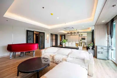 Luxurious open-plan living room with grand piano and modern dining area, perfect for entertaining.