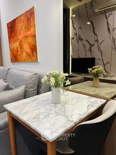 Stylish modern living room with marble table and elegant decor