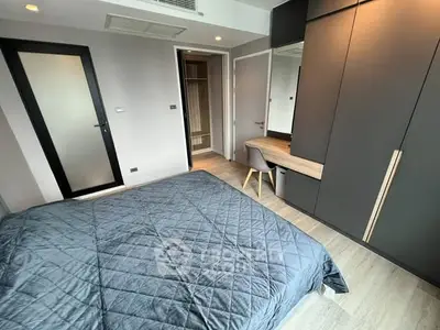 Modern bedroom with sleek design and built-in wardrobe