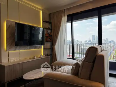 Luxurious living room with city view and modern decor, featuring a large TV and comfortable seating.