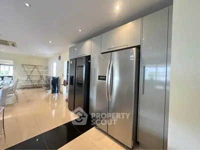 Modern kitchen with sleek stainless steel appliances and spacious layout