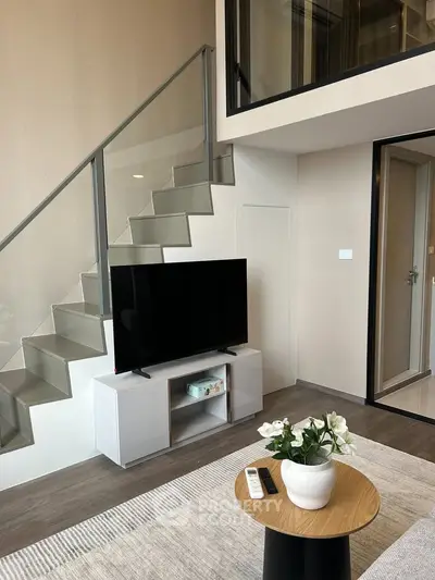 Modern duplex living room with sleek staircase and stylish decor