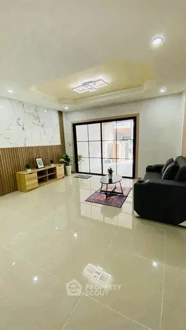 Spacious modern living room with elegant decor and large windows