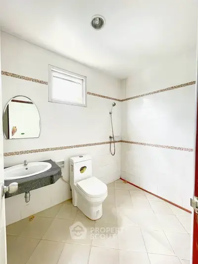 Spacious bathroom with modern fixtures and natural light