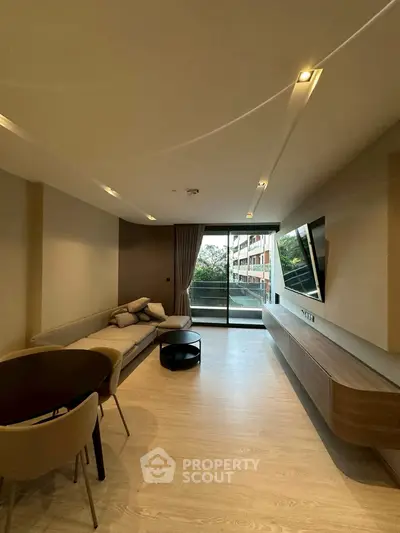 Modern living room with sleek design and balcony view