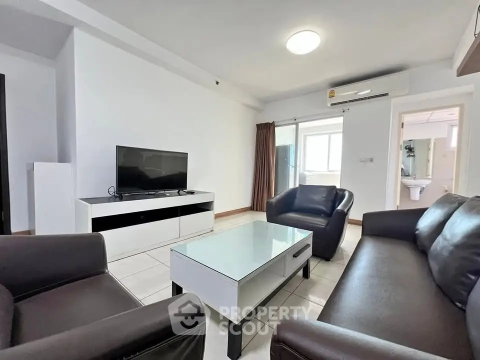 Modern living room with sleek furniture and natural light