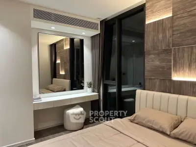 Modern bedroom with elegant decor and large mirror in luxury apartment