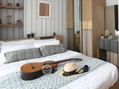 Chic bedroom with modern decor, featuring a cozy bed, stylish guitar, and elegant hat for a trendy lifestyle.