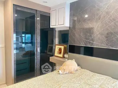 Modern bedroom with stylish wardrobe and elegant decor