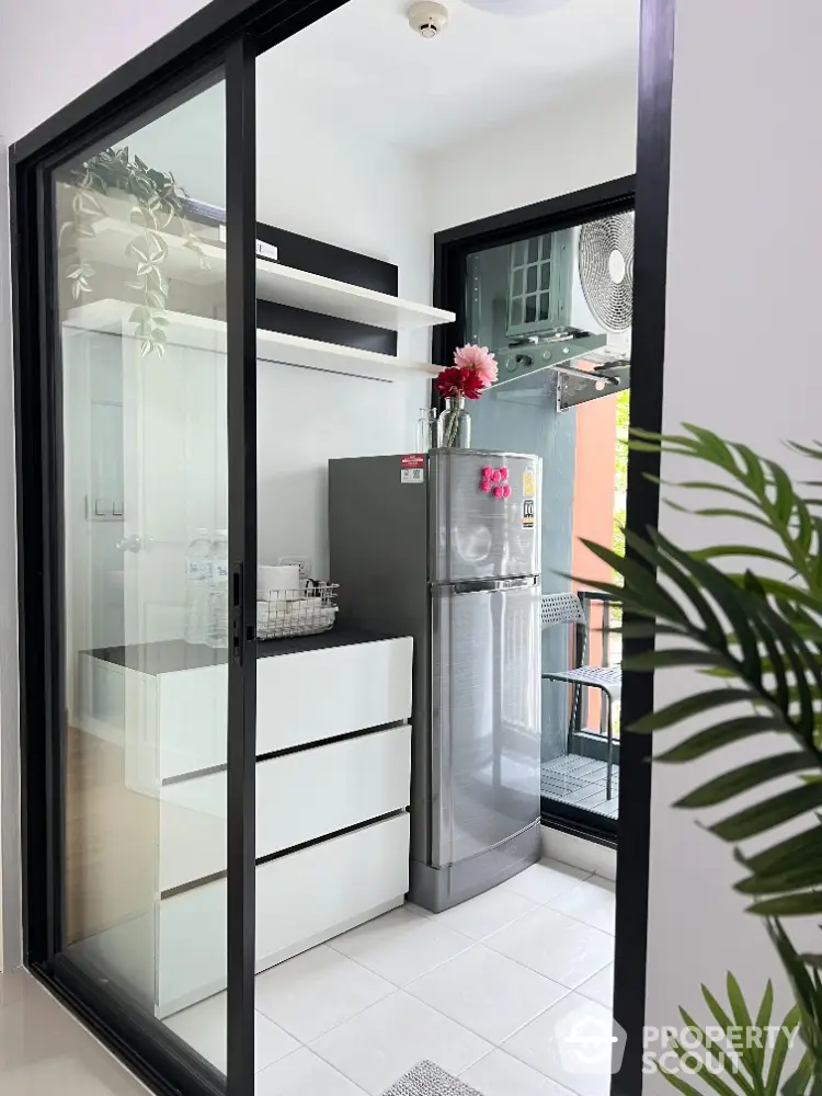 Modern kitchen with sleek design and stainless steel fridge in stylish apartment