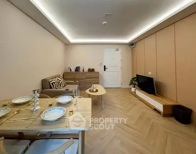 Modern living room with stylish furniture and elegant dining setup