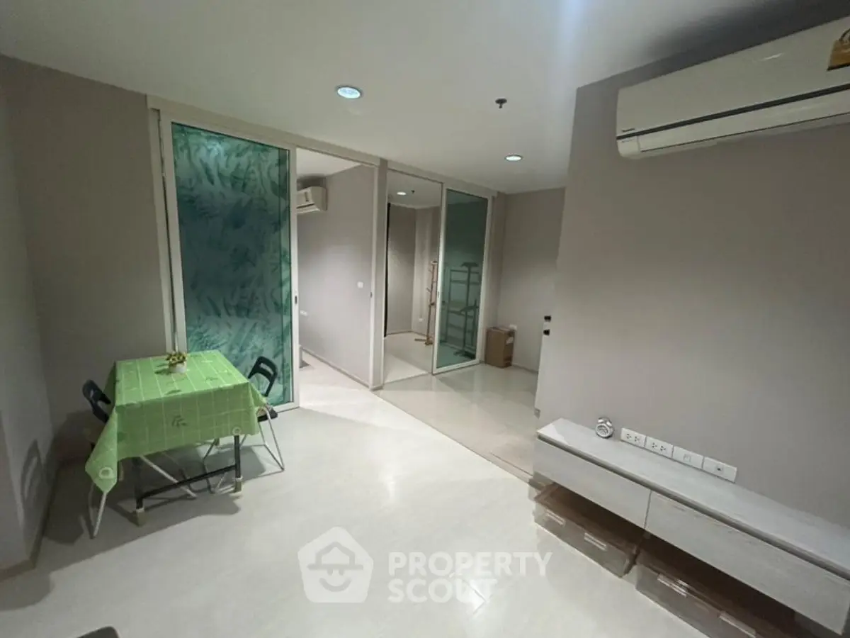 Modern living room with minimalist decor and air conditioning in a stylish apartment.
