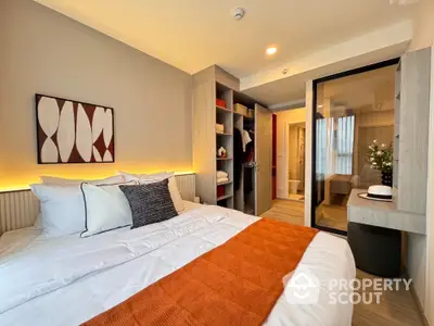 Modern bedroom with stylish decor and ample storage space