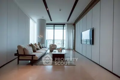 Luxurious modern living room with floor-to-ceiling windows and elegant decor.