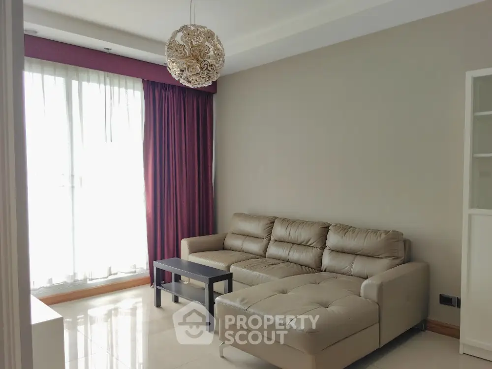 Modern living room with elegant leather sofa and stylish lighting