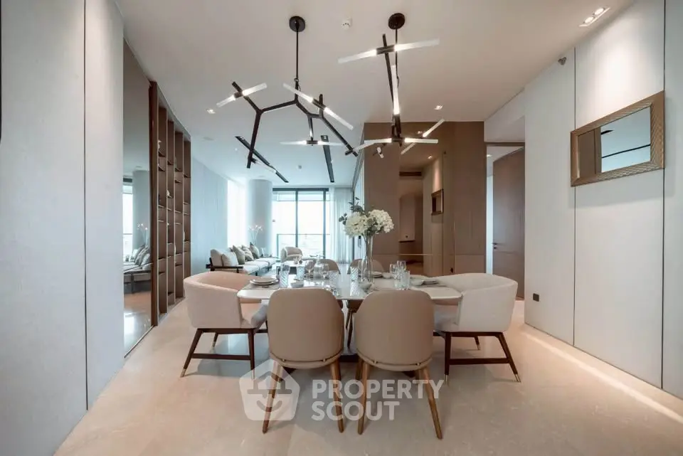Luxurious modern dining area with elegant lighting and spacious seating in a high-end apartment.