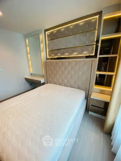 Luxurious bedroom with elegant upholstered headboard and built-in lighting