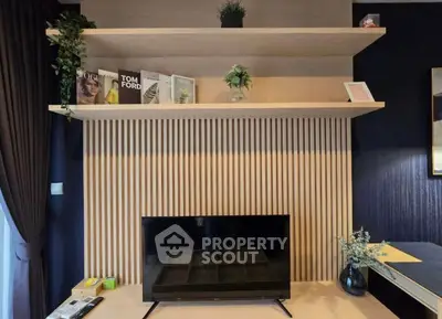 Modern living room with stylish shelving and flat-screen TV