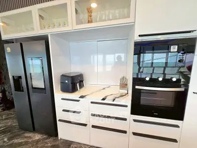 Modern kitchen with sleek appliances and stylish cabinetry