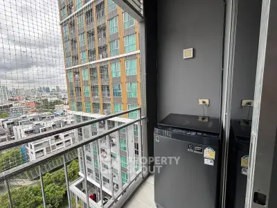 High-rise balcony with city view and washing machine, perfect for urban living.
