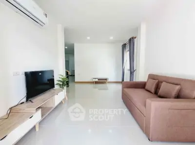 Modern living room with sleek furniture and bright natural lighting
