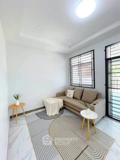 Bright and cozy living room with modern sofa and stylish decor