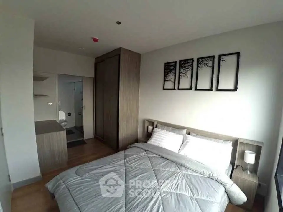 Modern bedroom with stylish decor and ample natural light