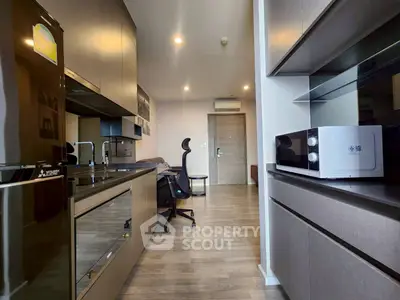 Modern kitchen with sleek appliances and open layout in stylish apartment