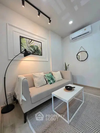 Chic modern living room with stylish decor and cozy ambiance, featuring a sleek sofa and elegant lighting.