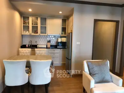 Charming open-layout kitchen and dining area with elegant seating and modern appliances.