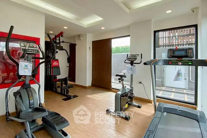 Modern gym with state-of-the-art equipment in a residential building.