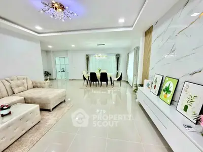 Spacious modern living room with elegant decor and open dining area