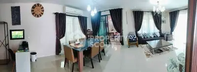Spacious living and dining area with elegant decor and large windows