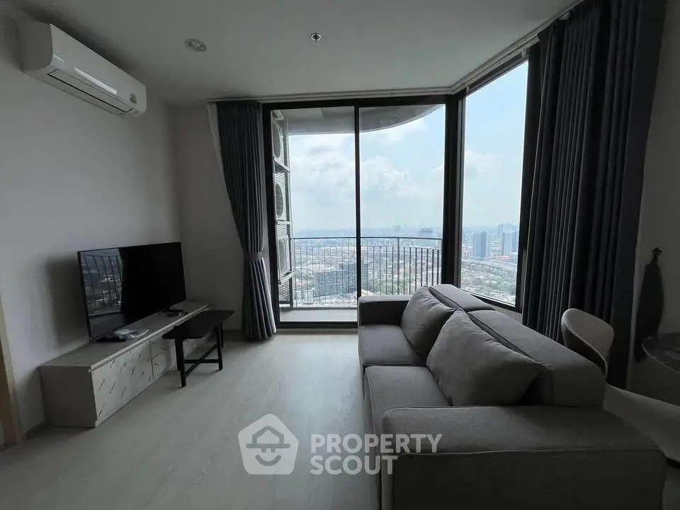 Modern living room with panoramic city view and stylish furnishings