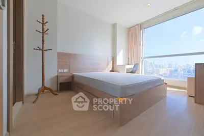 Bright modern bedroom with city view and minimalist design