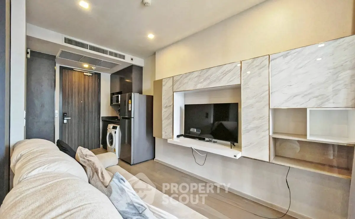 Modern living room with sleek furniture and built-in entertainment center