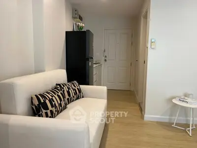 Cozy living room with modern decor and stylish furniture in a contemporary apartment.