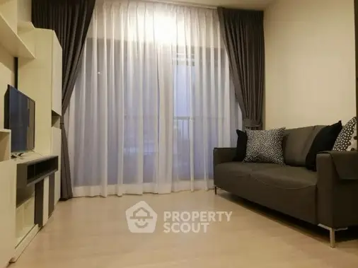 Modern living room with elegant curtains and cozy sofa