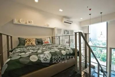 Modern loft bedroom with stylish decor and large window view