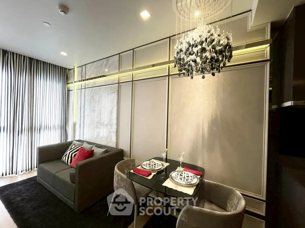 Luxurious living room with elegant chandelier and modern decor