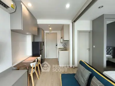 Modern apartment interior with open kitchen and cozy living area