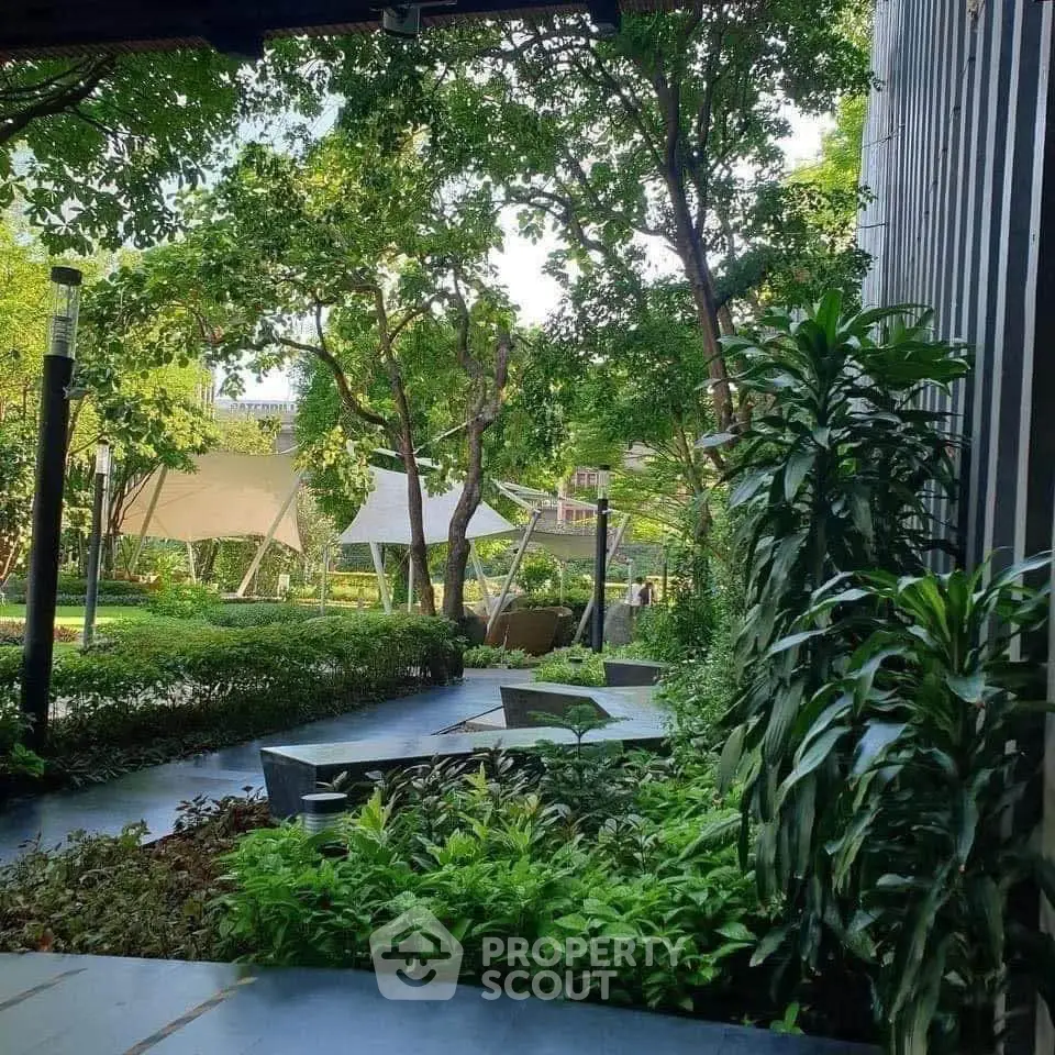 Lush garden area with modern landscaping and seating, perfect for relaxation and outdoor enjoyment.