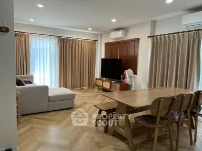 Spacious living room with modern furniture and natural light