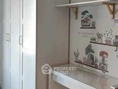 Charming study nook with wall art and sleek white furniture