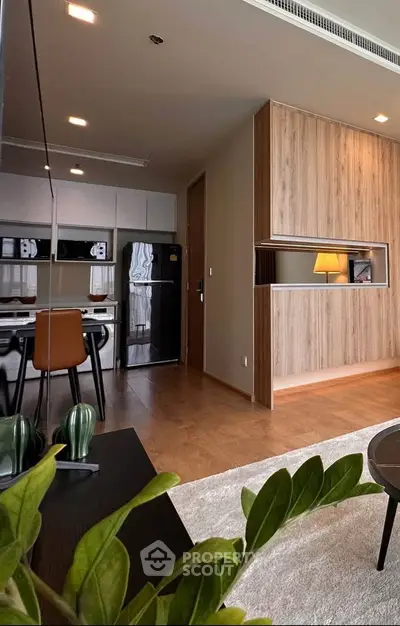 Modern open-plan living room with stylish kitchen and cozy decor