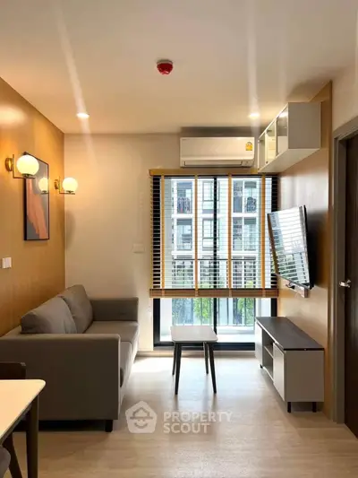 Modern living room with stylish decor and large window view